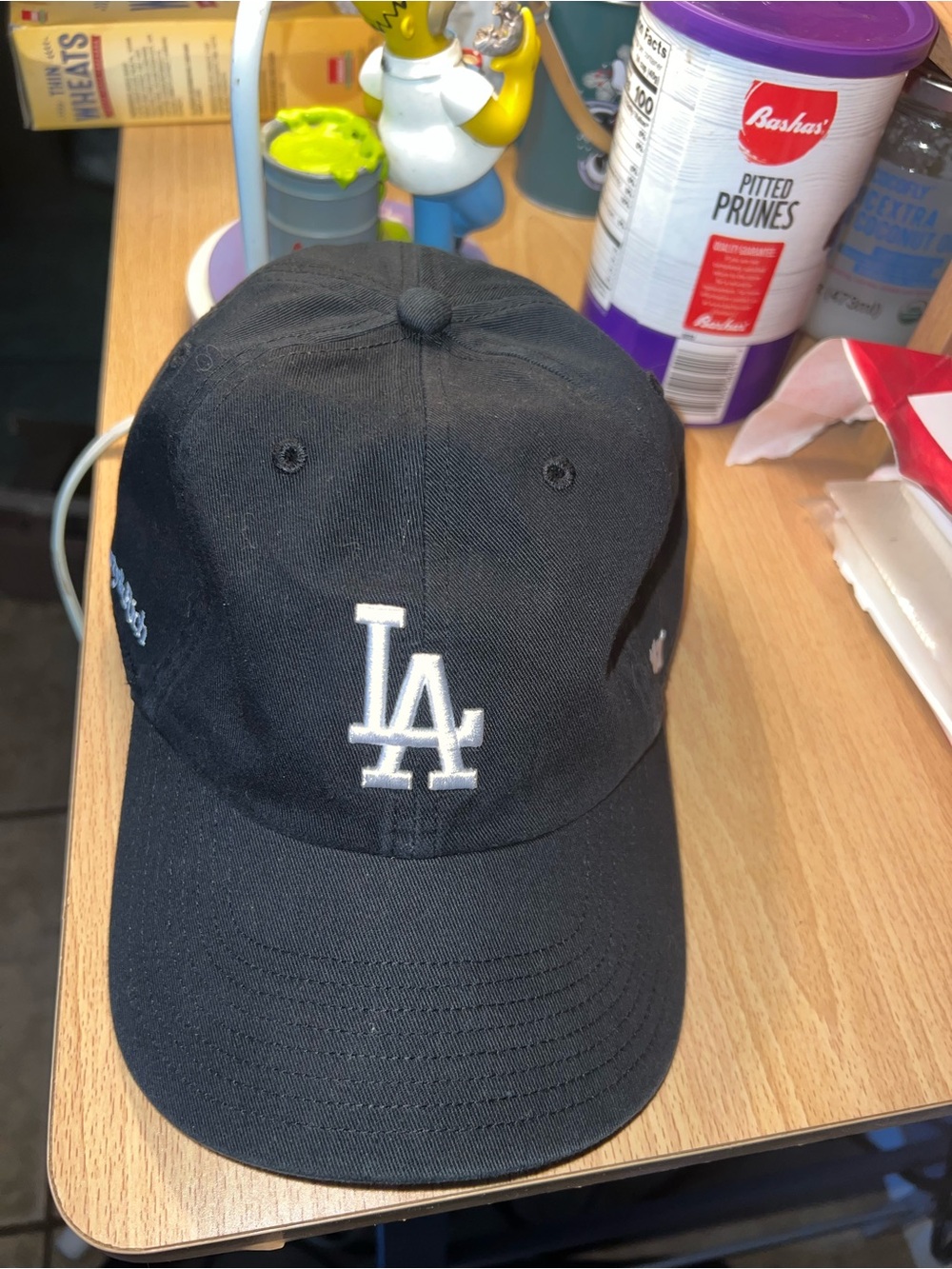 Sporty & Rich 47  Black Baseball Cap with White LA Logo